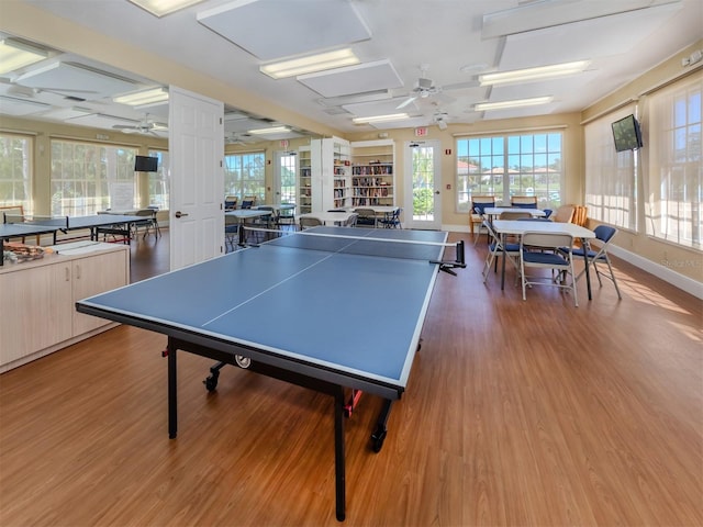 recreation room featuring ceiling fan and hardwood / wood-style floors