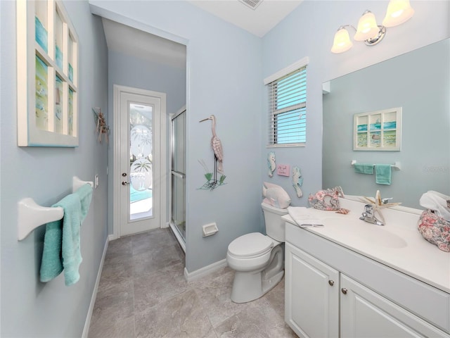 bathroom with an enclosed shower, vanity, and toilet