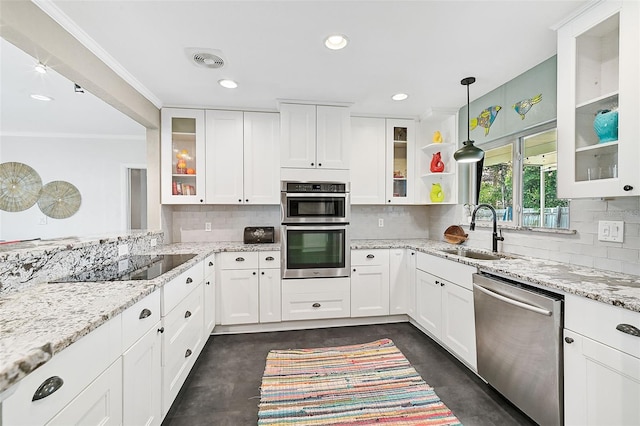 kitchen featuring stainless steel appliances, white cabinetry, tasteful backsplash, sink, and pendant lighting