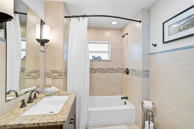 bathroom featuring vanity and shower / tub combo