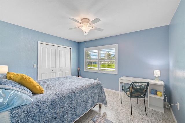 bedroom with ceiling fan and a closet