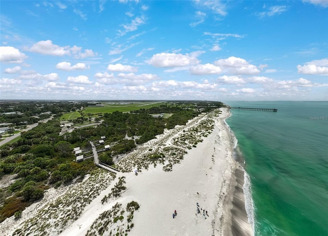 aerial view featuring a view of the beach and a water view