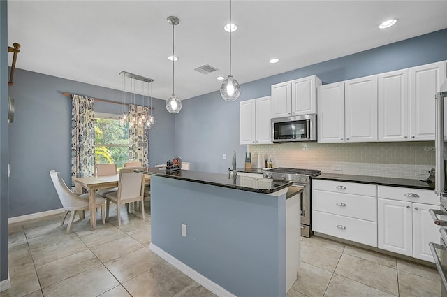 kitchen with backsplash, stainless steel appliances, a center island with sink, light tile patterned flooring, and hanging light fixtures