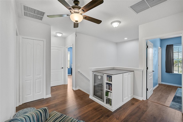 hallway with dark wood-type flooring