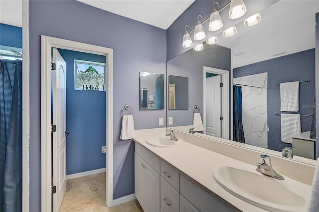 bathroom featuring a shower with shower curtain, vanity, and tile patterned floors