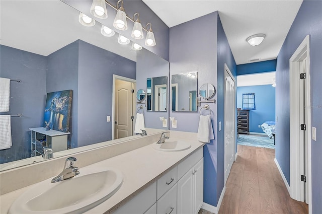 bathroom featuring vanity and hardwood / wood-style floors