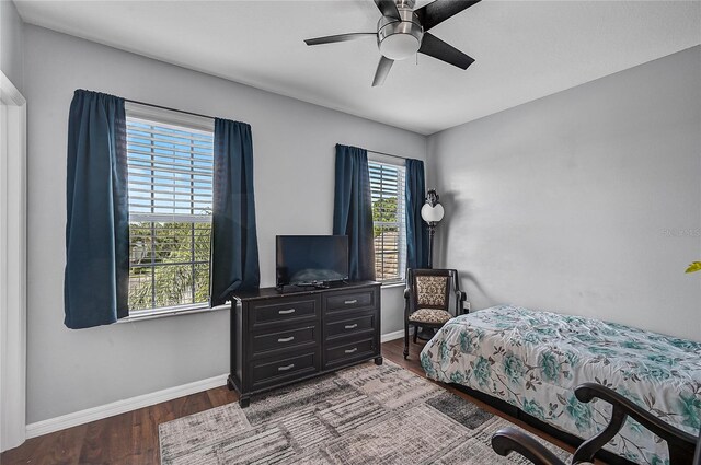 bedroom with ceiling fan and hardwood / wood-style flooring