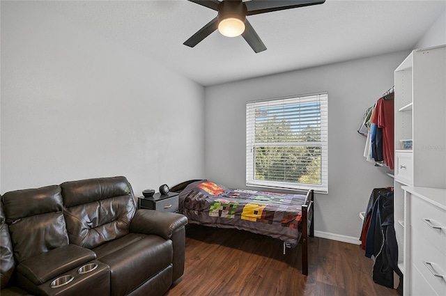 bedroom featuring ceiling fan and dark wood-type flooring