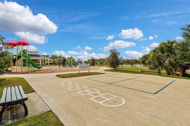 view of property's community featuring a playground and a yard