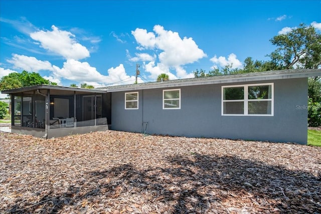 rear view of house with a sunroom