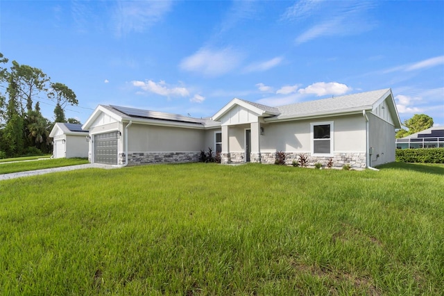 view of front of property with a garage and a front lawn