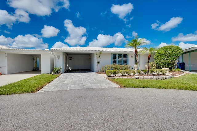 view of front of home with a carport