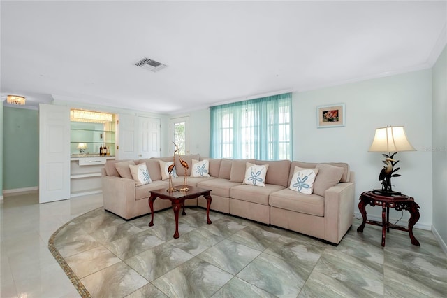 tiled living room with crown molding