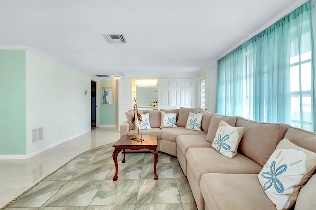 living room with crown molding and light tile patterned flooring