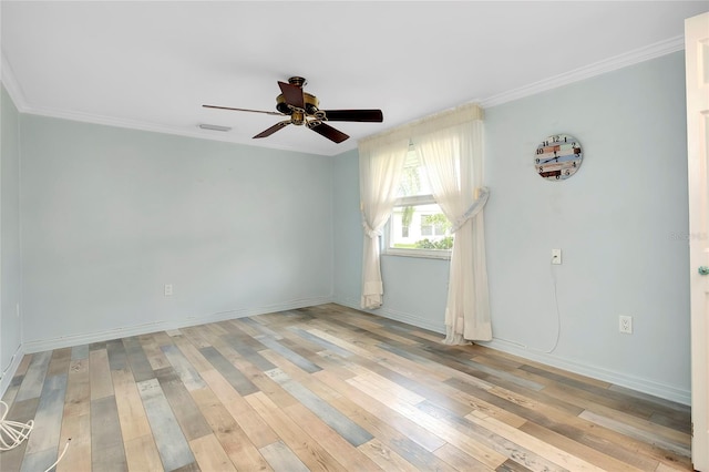 spare room featuring crown molding, ceiling fan, and light hardwood / wood-style floors