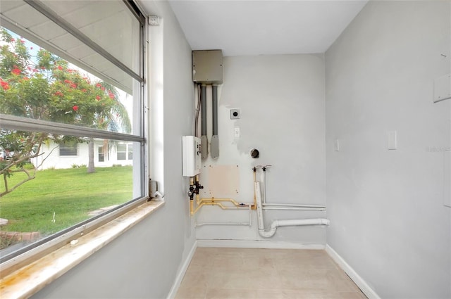 laundry room with light tile patterned flooring and electric dryer hookup