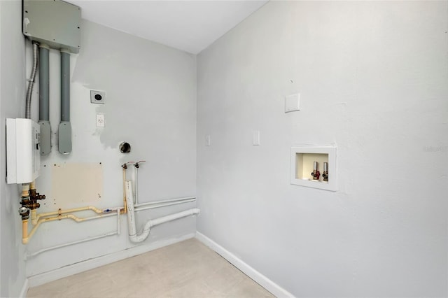 clothes washing area featuring washer hookup, light tile patterned floors, and electric dryer hookup