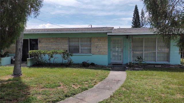 ranch-style house with a front yard