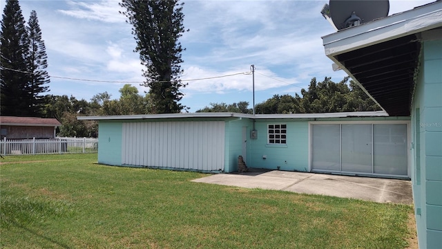 view of outbuilding featuring a lawn