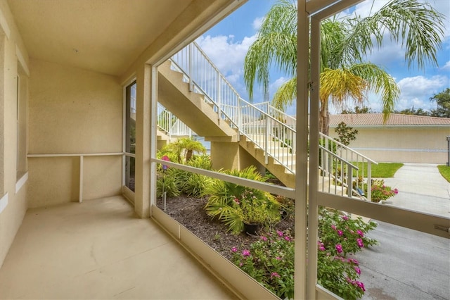 balcony featuring stairs