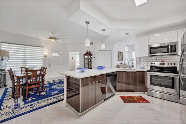 kitchen with light tile patterned flooring, appliances with stainless steel finishes, ceiling fan, and white cabinets