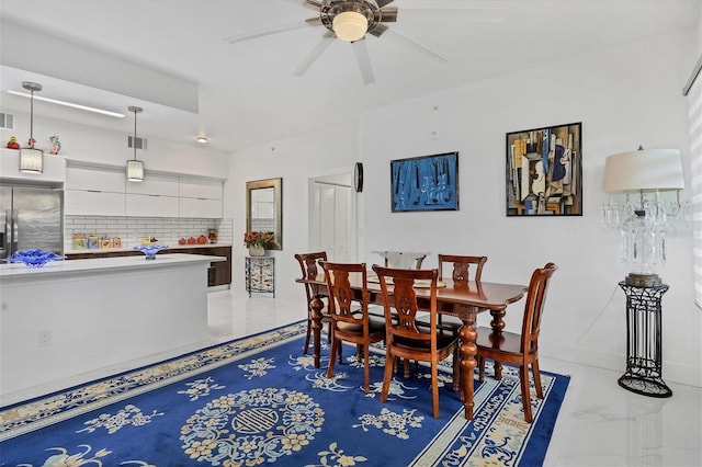 dining room featuring marble finish floor, visible vents, and ceiling fan