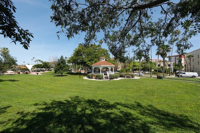 surrounding community with a lawn and a gazebo