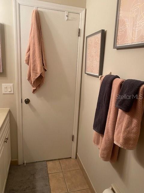 bathroom with vanity and tile patterned floors