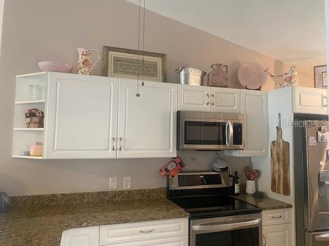 kitchen with stainless steel appliances and white cabinets