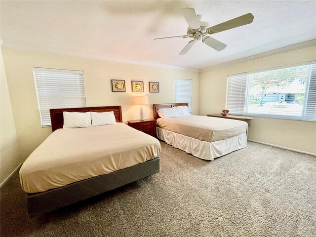 bedroom with ceiling fan, carpet, and ornamental molding