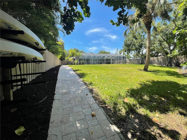 view of yard featuring glass enclosure