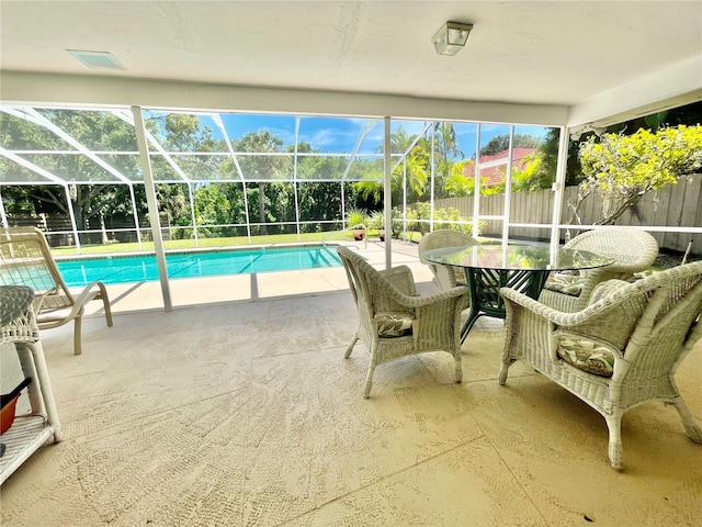 view of pool with a lanai and a patio