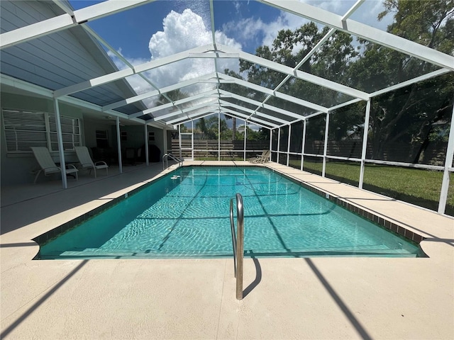 view of pool featuring a patio and glass enclosure