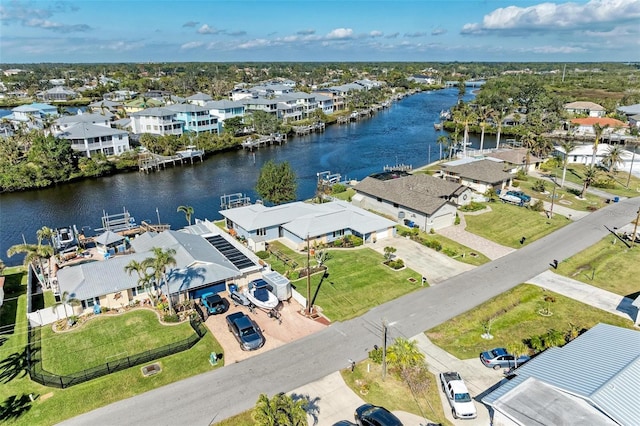 drone / aerial view with a water view