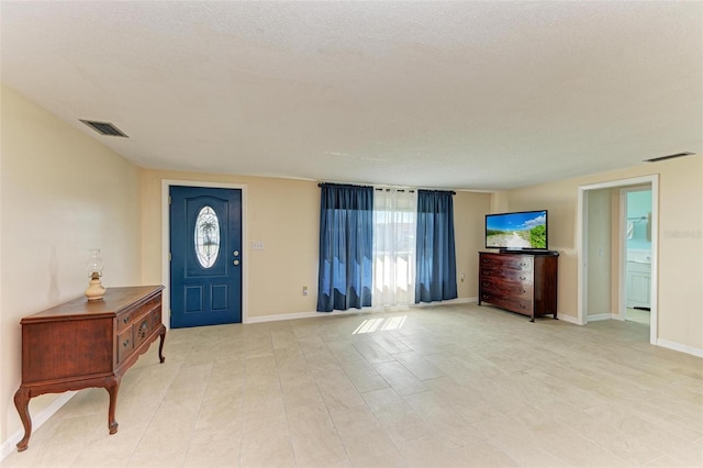 entrance foyer with a textured ceiling