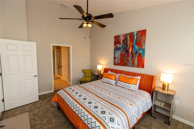 bedroom featuring ceiling fan, high vaulted ceiling, ensuite bathroom, and carpet flooring