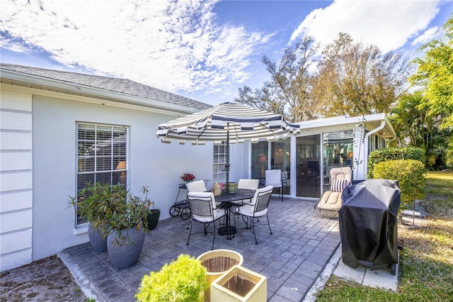 view of patio with outdoor dining space and area for grilling