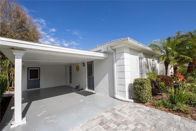 exterior space featuring a carport