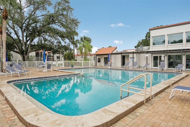 view of swimming pool with a patio area