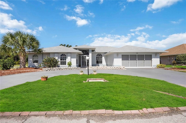 ranch-style house with a garage and a front yard