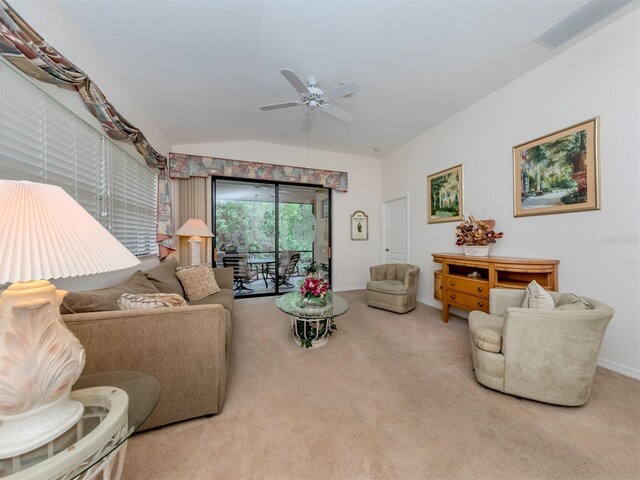 carpeted living room featuring lofted ceiling and ceiling fan