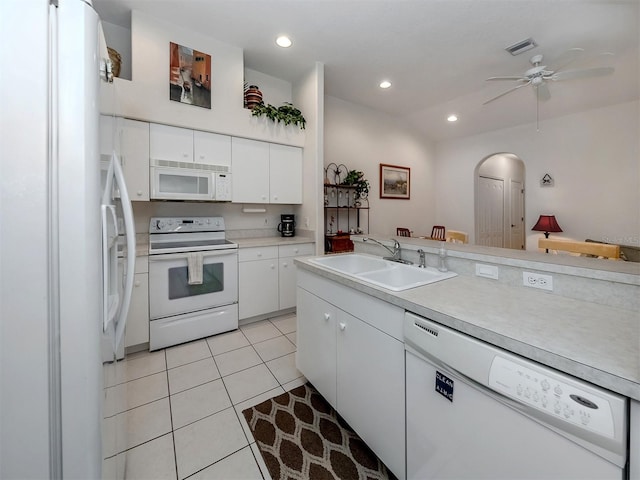 kitchen featuring light tile patterned floors, white appliances, white cabinetry, sink, and ceiling fan