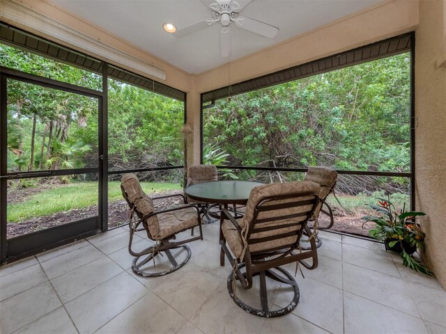 sunroom / solarium with ceiling fan and a wealth of natural light