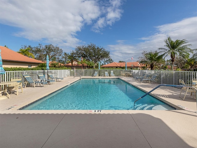 view of swimming pool with a patio