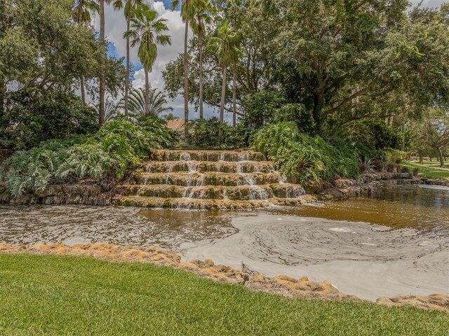 surrounding community featuring a water view