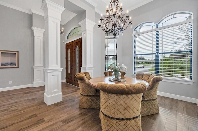 2197 Nita Ter, North Port, FL 34286 - dining room featuring dark wood-style floors, ornamental molding, an inviting chandelier, and decorative columns