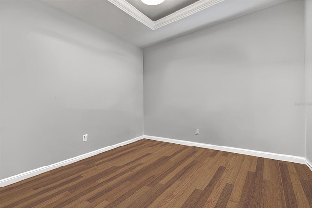 spare room with hardwood / wood-style flooring and ornamental molding