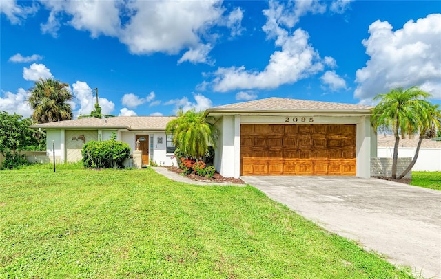 ranch-style house with a garage and a front yard