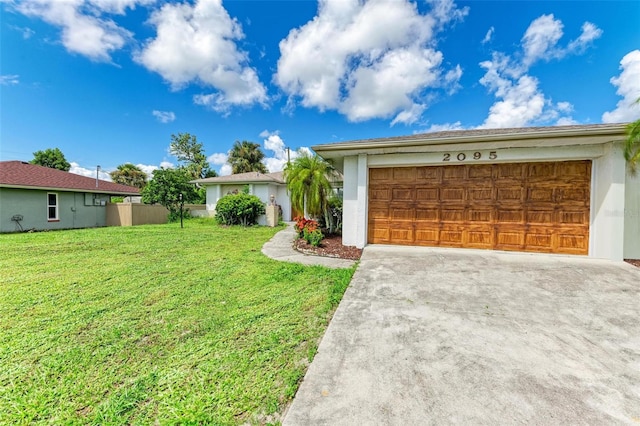 ranch-style home featuring a garage and a front yard