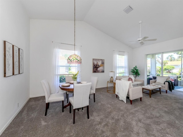 dining room featuring carpet floors, high vaulted ceiling, and ceiling fan